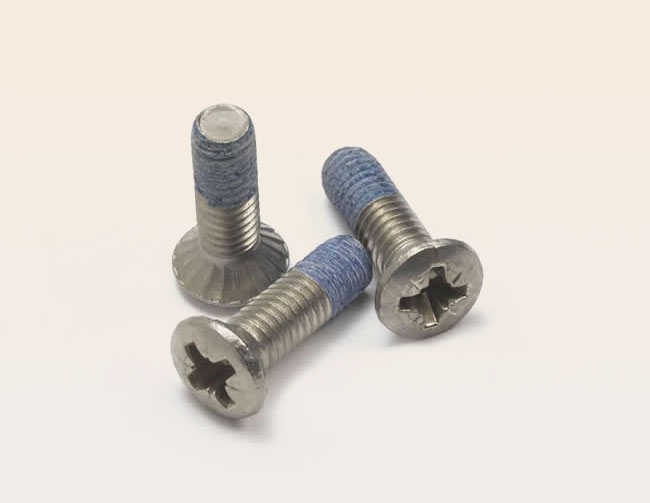 Countersunk round head screw with pozidrive recess and antivibration coating