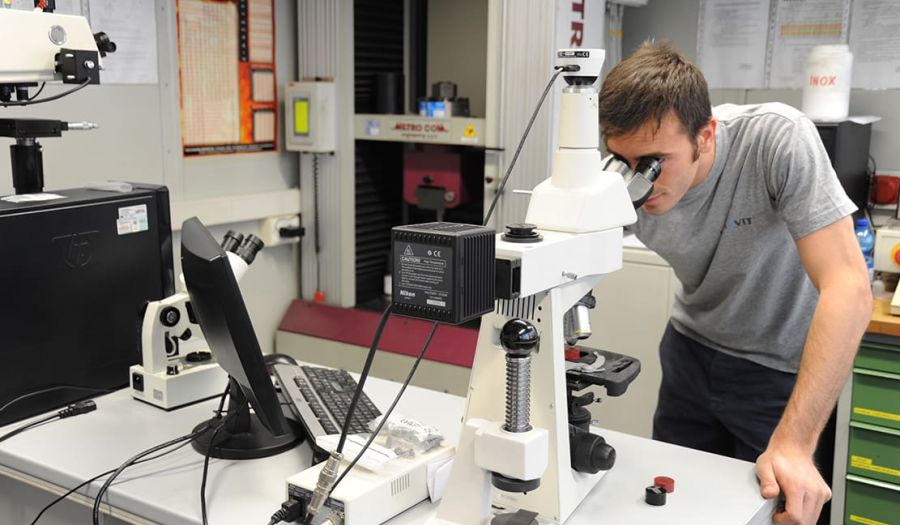 Mecavit operator inspecting quality under the microscope